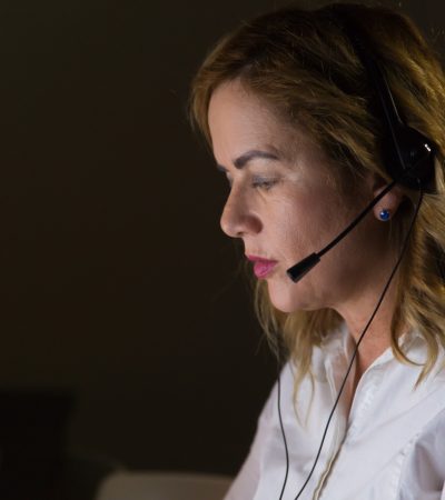 female-call-center-operator-dark-office